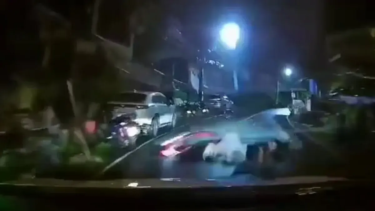 Tourist Motorcycle Crashes Into Taxi On Wet Patong Road
