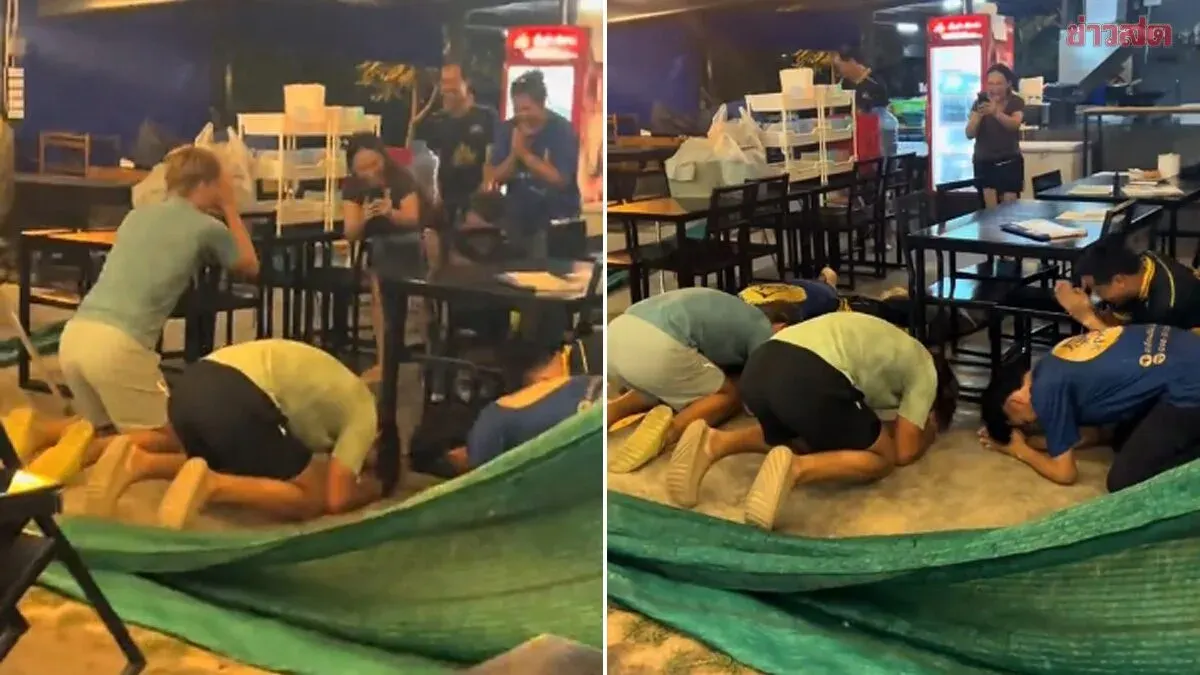 Foreign Visitors Bow in Gratitude at Thai Restaurant