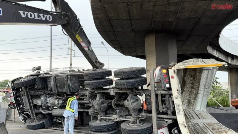 Dump Truck Crashes Into Overpass, Injuring Driver And Child