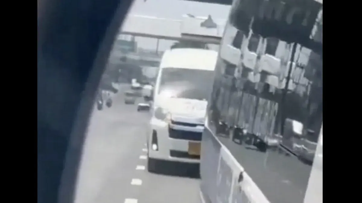 Phuket Van Driver Criticized For Tailgating Ambulance Through Red Light