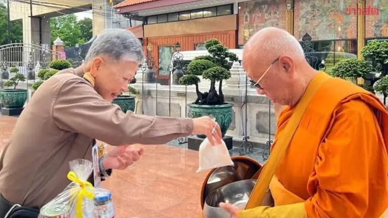 Royal Merit-Making Ceremony: Her Majesty Chanthani Presents Alms to Abbot of Wat Semyanari