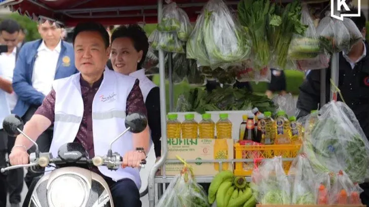 Anutin Takes Motorcycle Grocery Cart for Spin Around Thai Khu Fah Building to Promote Thai Help Thai Campaign