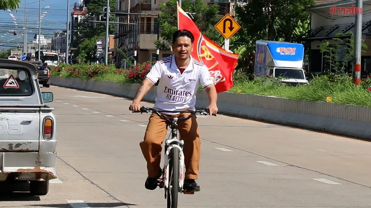 Solo Arsenal Fan Cycles Through Town Celebrating Championship After 22 Years