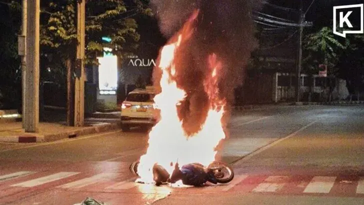 Motorcycle bursts into flames after crash in Bangkok