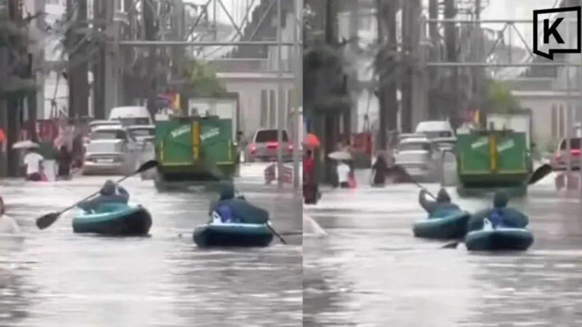 Bangkok Residents Paddle Home by Kayak as Floods Choke Streets