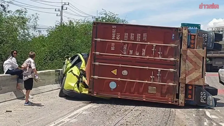Trailer Flips on Overpass, Crushes EV; Three Injured