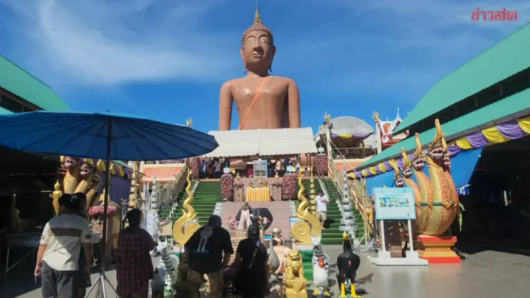 Woman Seeks Lottery Luck at Revered Buddha Statue