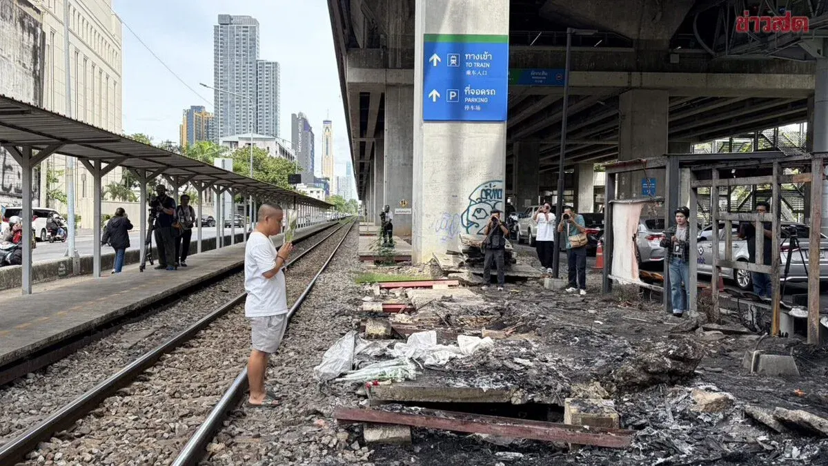 Mourners Leave Flowers at Site of Train-Bus Collision That Killed 8