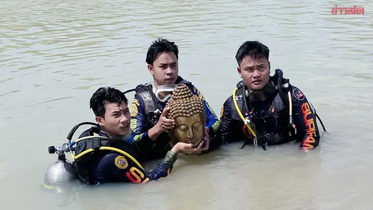 Man Searching for Clams Discovers Decapitated Buddha Head Underwater
